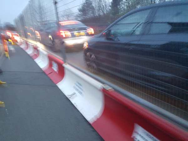 blurred cars through scaffold 20240327 182909